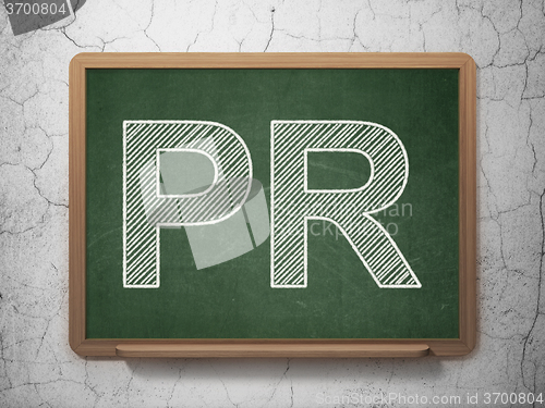 Image of Marketing concept: PR on chalkboard background