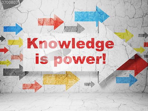 Image of Education concept: arrow with Knowledge Is power! on grunge wall background