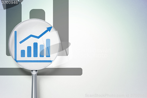 Image of Business concept:  Growth Graph with optical glass on digital background