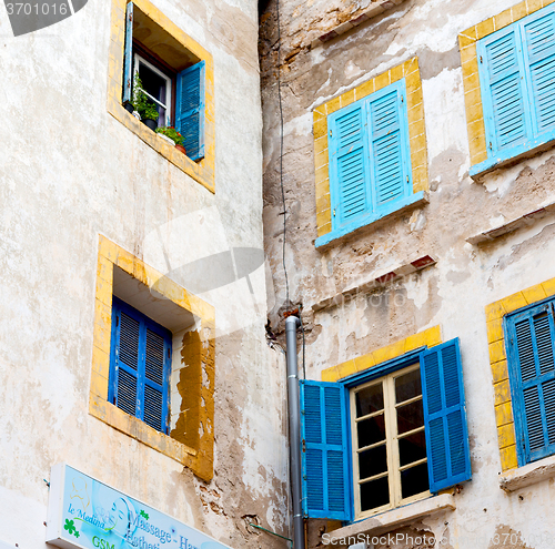 Image of blue window in morocco africa old construction and brown wall  c