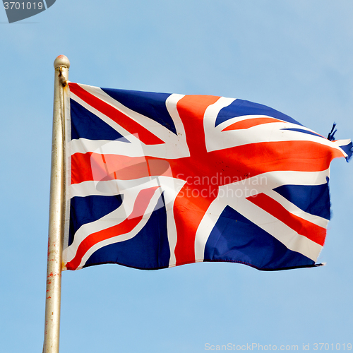 Image of waving flag in the blue sky british colour and wave