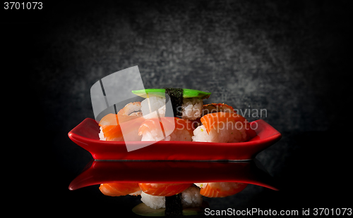 Image of Sushi on red plate