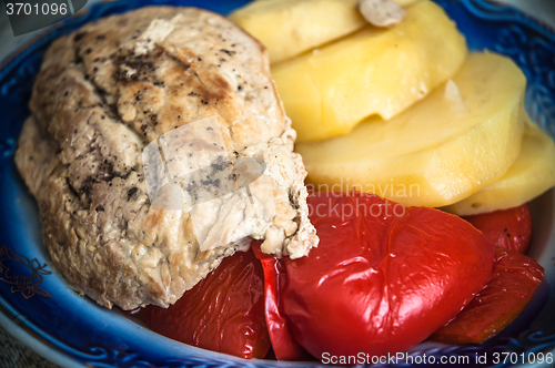 Image of Portion of stewed meat with vegetables 