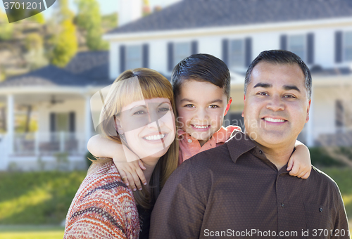 Image of Happy Mixed Race Young Family in Front of House