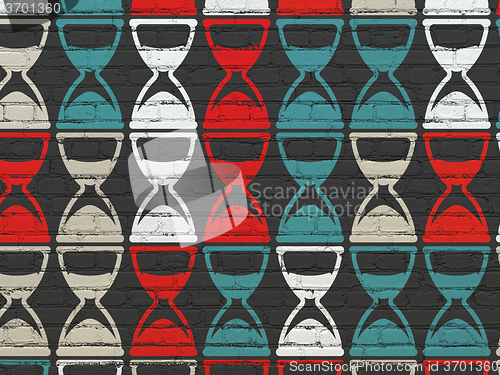 Image of Timeline concept: Hourglass icons on wall background