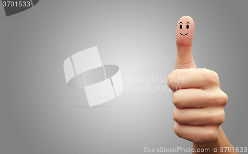 Image of Happy cheerful smiley finger on grey background