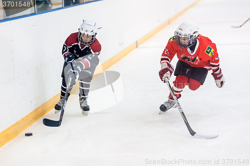 Image of Game of children ice-hockey teams