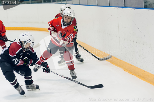 Image of Game of children ice-hockey teams