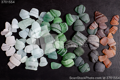 Image of bottle necks glass pieces polished by the sea 