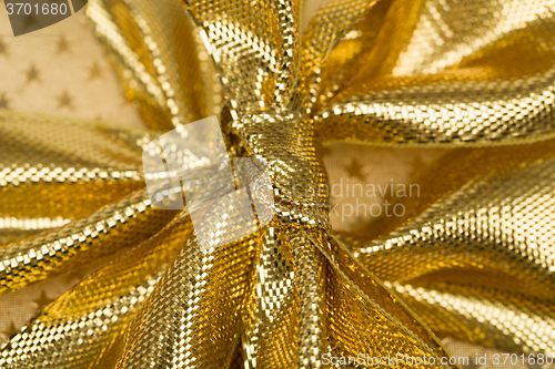 Image of detail of golden ribbon 