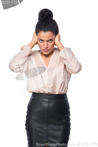 Image of Displeased business woman with hands on ears