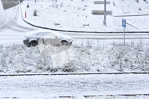 Image of Car parked on snowy street