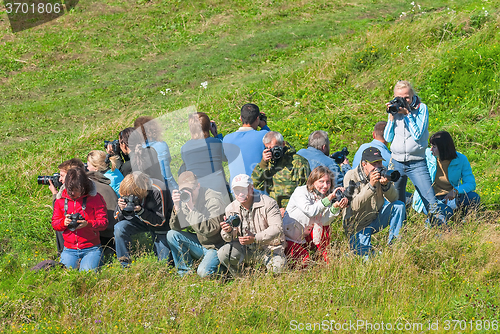 Image of Photographers got up with equipment in a circle