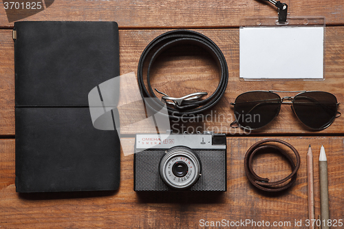 Image of Men\'s accessories on the wooden table