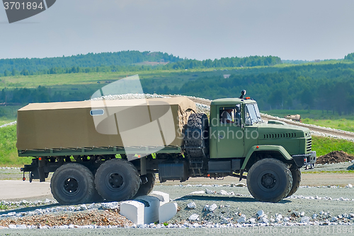 Image of Curtain sided truck comes through on obstacle