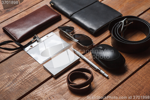 Image of Men\'s accessories on the wooden table