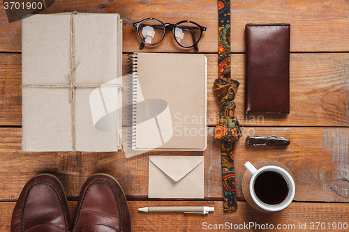 Image of Men\'s accessories on the wooden table