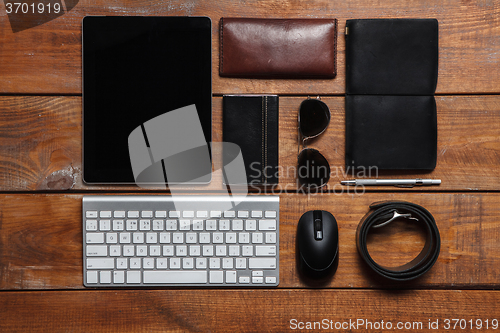 Image of Men\'s accessories on the wooden table