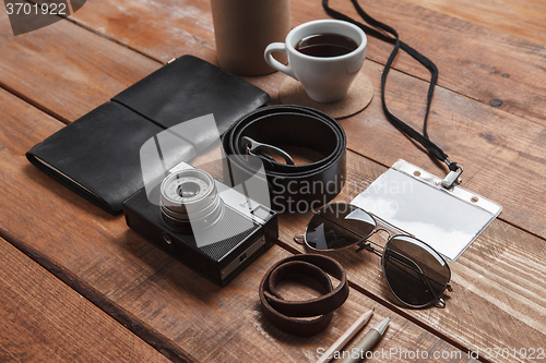 Image of Men\'s accessories on the wooden table