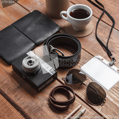 Image of Men\'s accessories on the wooden table