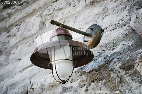Image of Street lamp on a wall, close-up