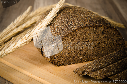 Image of Black homemade bread and rye cones, close-up 