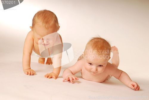 Image of Babies lying on a ground