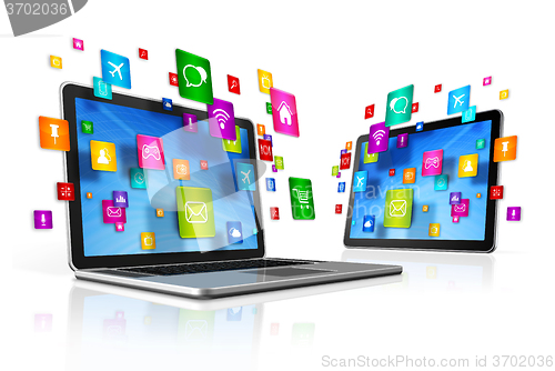 Image of Icons flying around Digital Tablet PC and Laptop