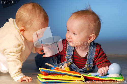 Image of Babies playing with toys