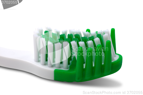 Image of Green toothbrush on white background