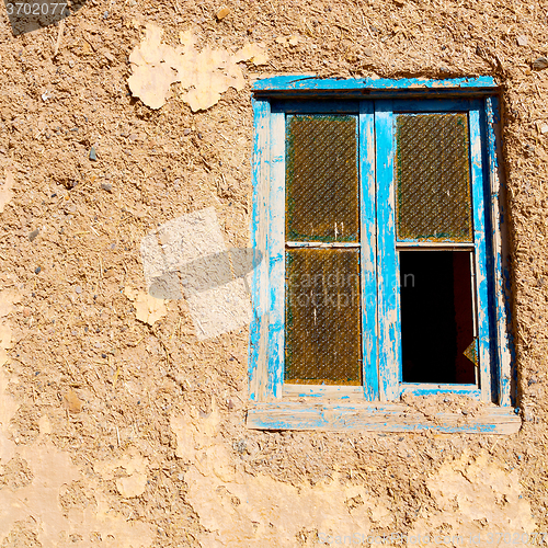 Image of blue window in morocco africa old construction and brown wall  c