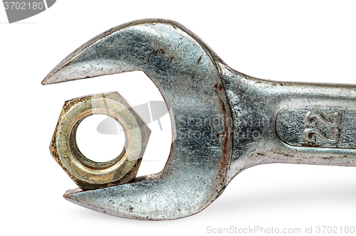 Image of Closeup an old wrench and nut