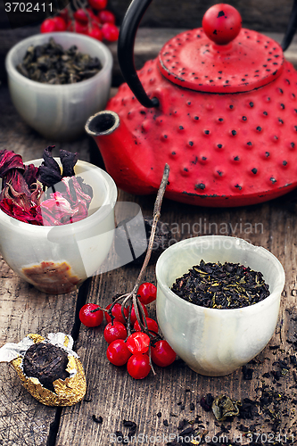 Image of Assortment of custard and red tea kettle