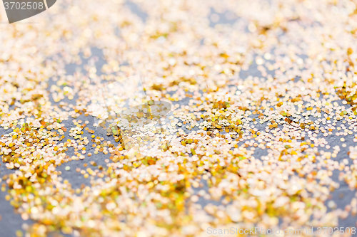 Image of golden glitter or yellow sequins background