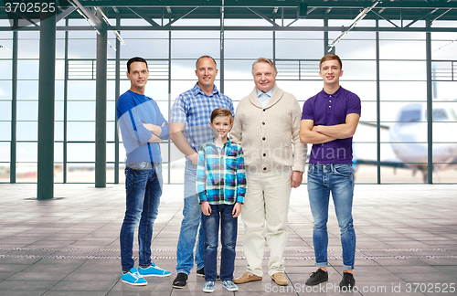 Image of group of men and boy over airport terminal