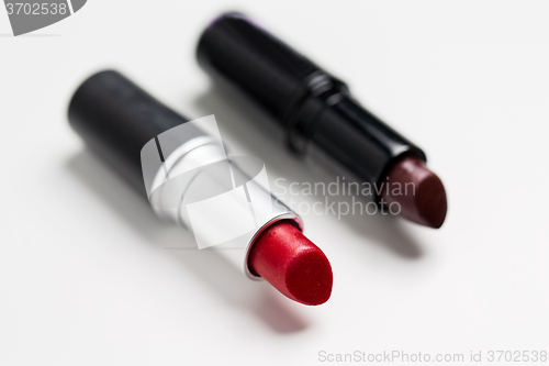 Image of close up of two open lipsticks