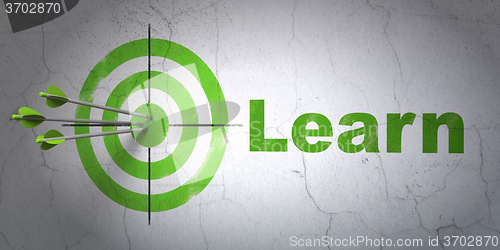 Image of Education concept: target and Learn on wall background