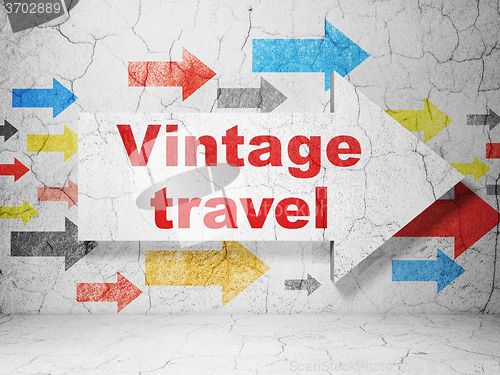 Image of Travel concept: arrow with Vintage Travel on grunge wall background