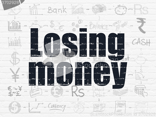 Image of Banking concept: Losing Money on wall background