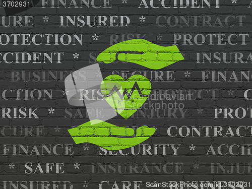 Image of Insurance concept: Heart And Palm on wall background