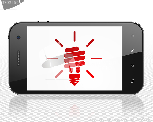 Image of Business concept: Smartphone with Energy Saving Lamp on display