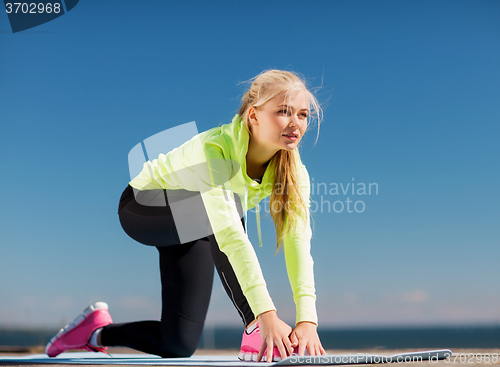 Image of woman doing sports outdoors