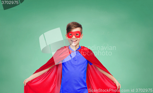 Image of boy in red super hero cape and mask