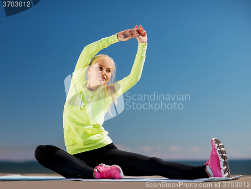 Image of woman doing sports outdoors