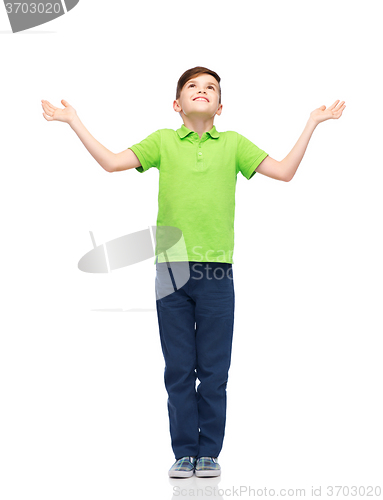 Image of happy boy in polo t-shirt raising hands up