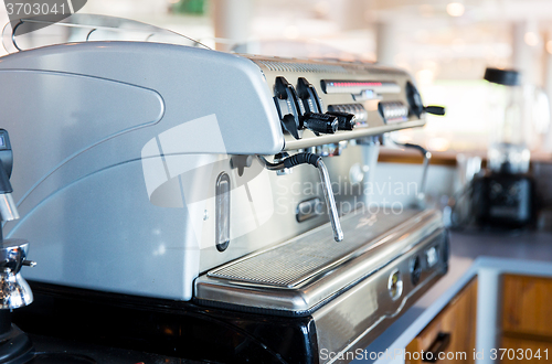 Image of close up of coffee machine at bar or restaurant