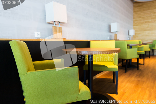 Image of restaurant interior with tables and chairs