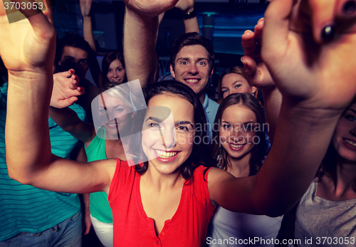 Image of smiling women dancing in club