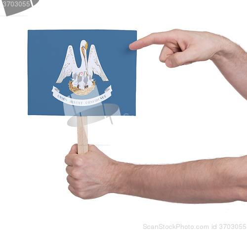 Image of Hand holding small card - Flag of Louisiana