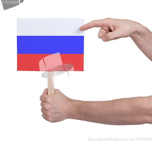 Image of Hand holding small card - Flag of Russia